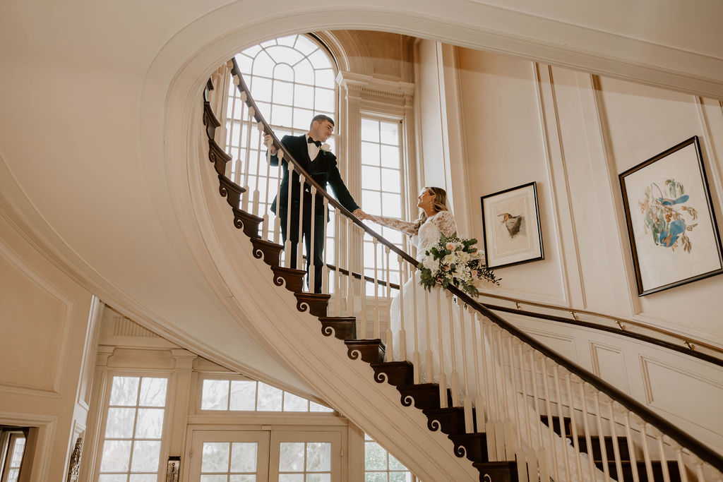 Bride and groom on a winding staircase